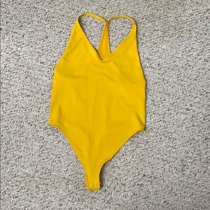 Yellow body suit